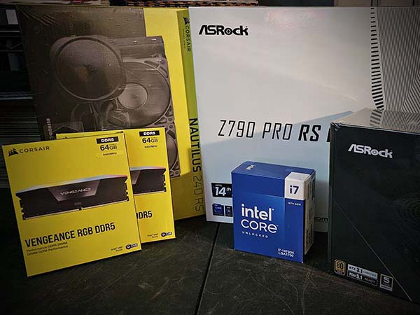 Computer hardware components in a box on a table.
